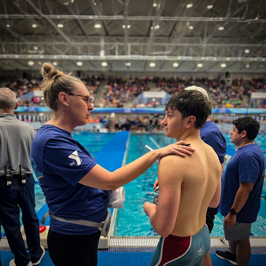 swimming coach and swimmer